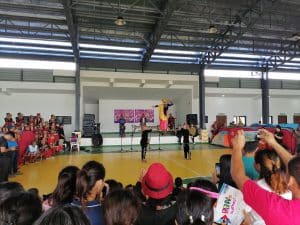 Audiences watch a performance at an evacuation center in the Municipality of Dujali, Davao del Norte.