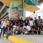 Kaisa sa Sining visual artists pose with one of the collaborative mural paintings on a beam post under the Tagum City flyover.