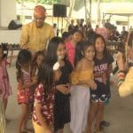 Kids interact with members of a performing group at an evacuation center in Barangay Cuambogan.