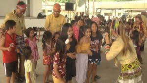 Kids interact with members of a performing group at an evacuation center in Barangay Cuambogan.