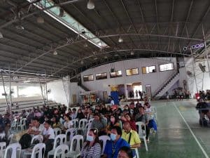 Audiences watch a performance at an evacuation center in the Municipality of Asuncion, Davao de Oro.