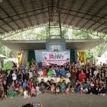 Children, artists, and other participating groups together at an evacuation center in Barangay San Miguel.