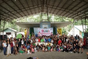 Children, artists, and other participating groups together at an evacuation center in Barangay San Miguel.