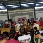 Crowds watch a group perform at an evacuation center in Barangay Bingkungan.