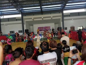 Crowds watch a group perform at an evacuation center in Barangay Bingkungan.